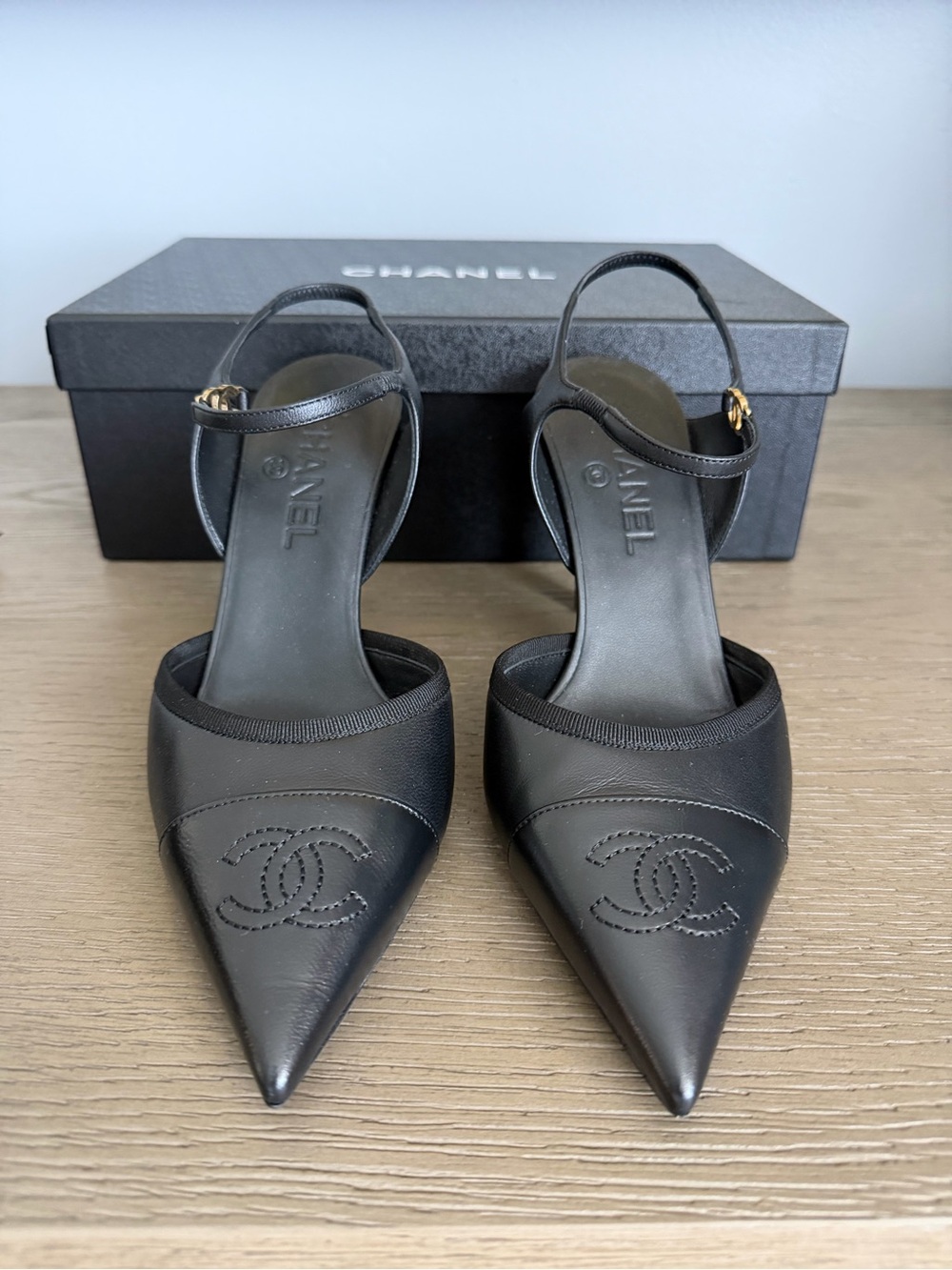 CHANEL Black Leather Pointed Slingback Heels with Gold CC Accent
